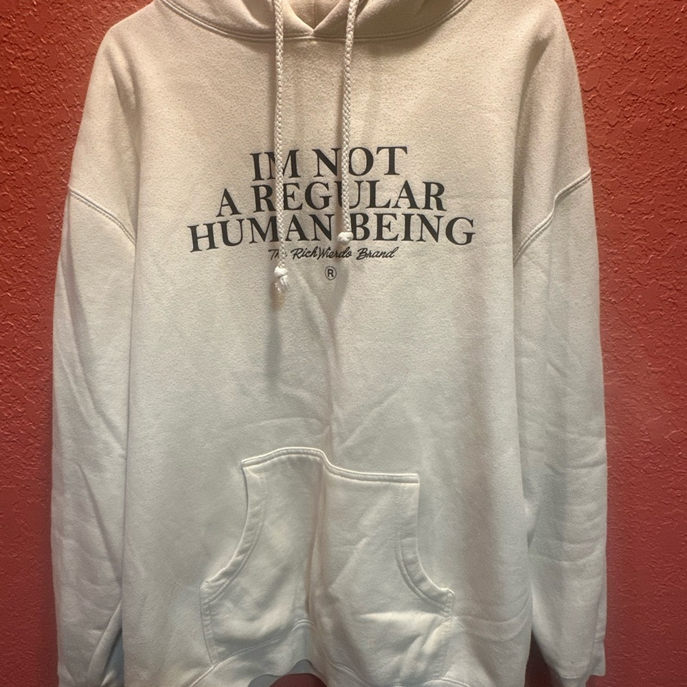 The Rich Weirdo Brand Cream Hoodie with Black Text